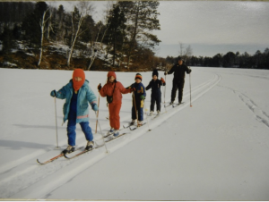 Children cross country skiing on frozen Lake Owen